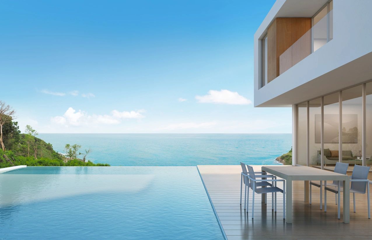 fm=f_V56nAVK A modern house with an ocean view and a pool.